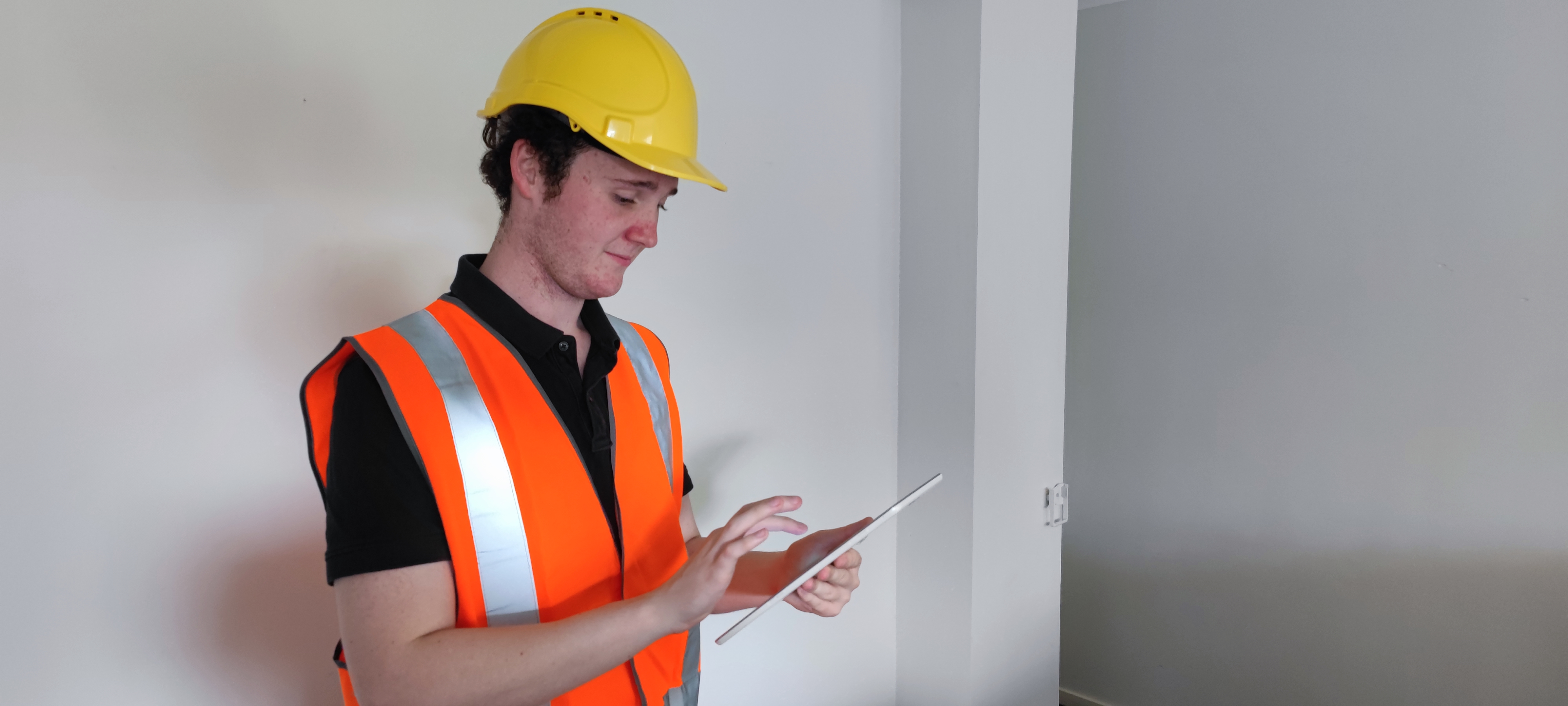 Image of a Tradesperson holding a tablet